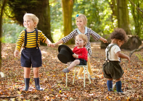Children at a woodland party — Stock Photo, Image