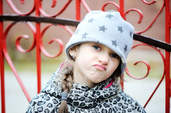 Little angry girl portrait outside — Stock Photo, Image