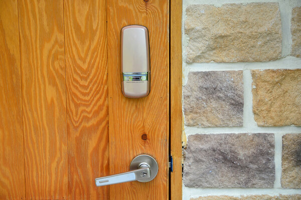 Electronic lock on wooden door 
