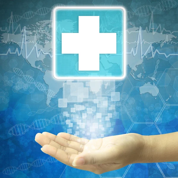 Hand hold on First Aid icon — Stock Photo, Image