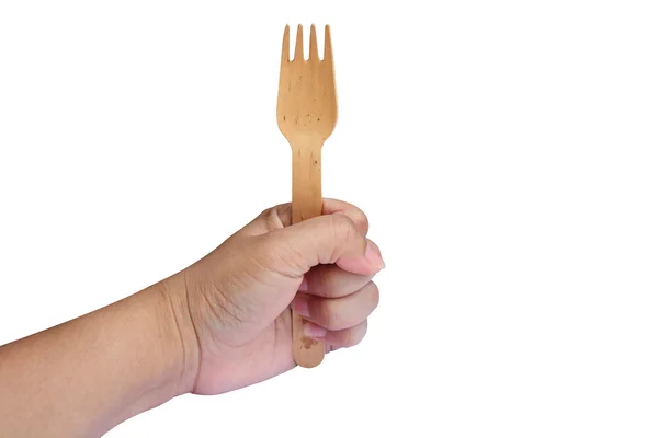 Wooden fork in hand isolated on a white background — Stock Photo, Image