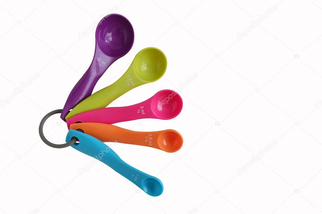 colorful measuring spoons isolated on white