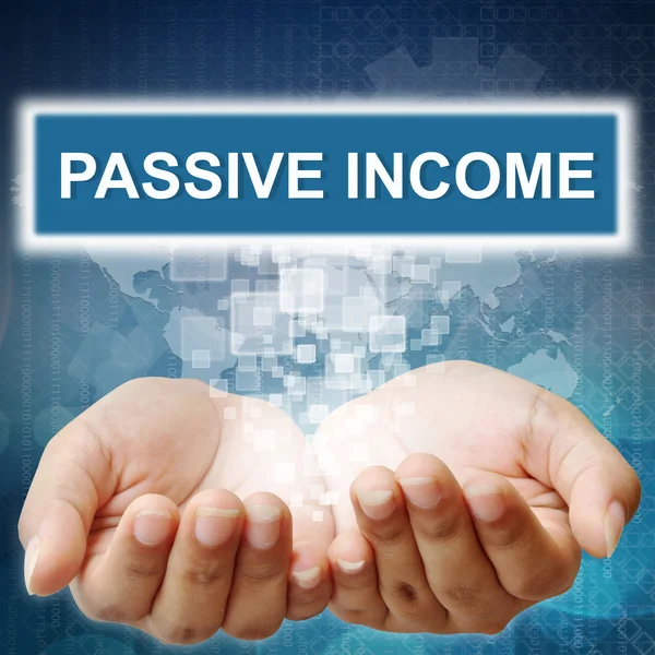 Hand pushing on touch screen interface "Passive Income " — стоковое фото