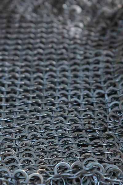 chain mail steel from rings upright background selective focus