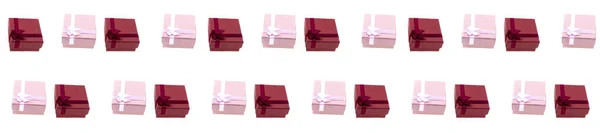 白色孤立背景边框上的粉色和红色礼品盒 — 图库照片