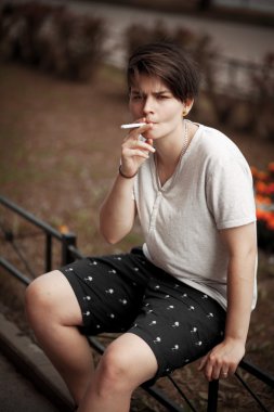 Queer girl smokes clipart