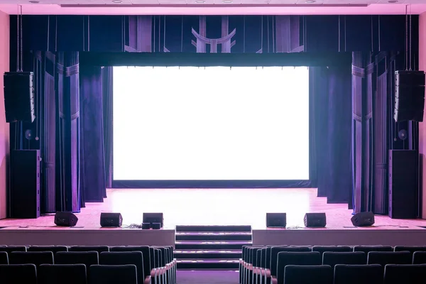 Concert hall of the theater with blue new chairs. The interior of the hall in the theater or cinema view of the stage