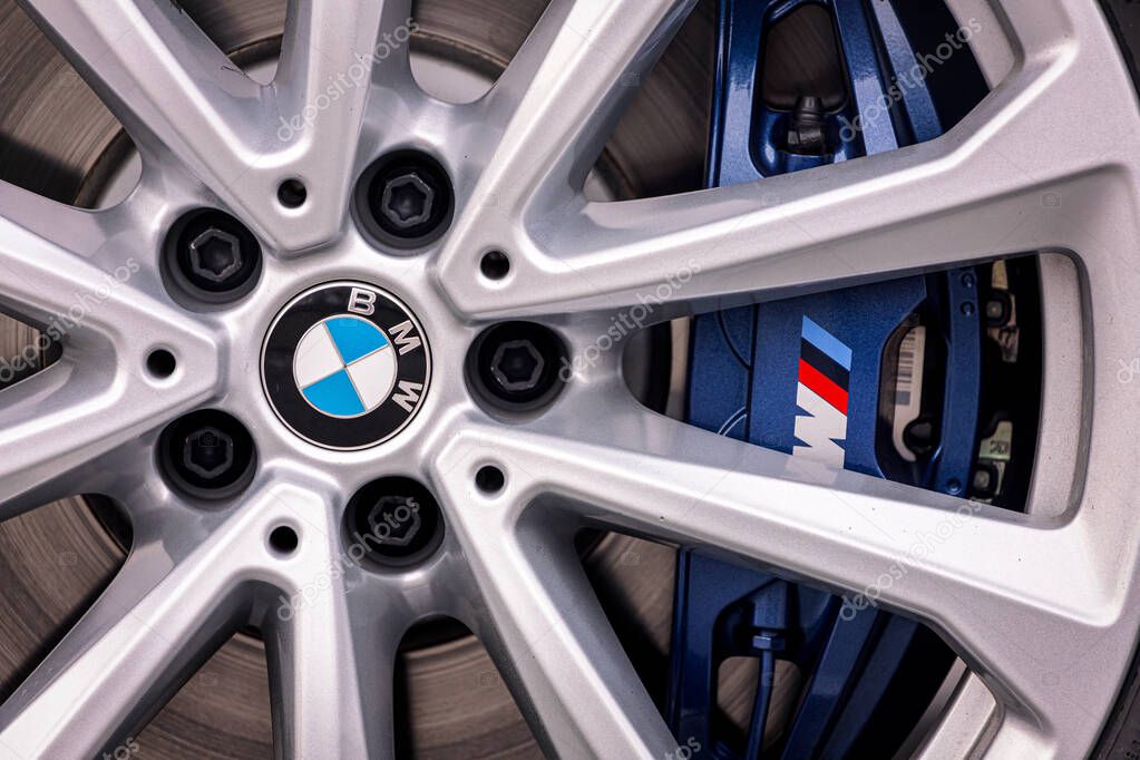 Novosibirsk, Russia  October 20, 2020:  BMW X5 M, wheel with new tire, logo BMW M and  brake support