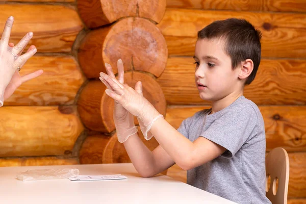 Little Boy Mom Put Disposable Surgical Gloves Get Ready Chemical — Stockfoto