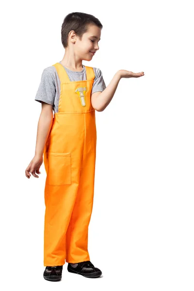 Portrait Smiling Boy Carpenter Orange Work Overalls Demonstrates Hand Looks — Stock Photo, Image