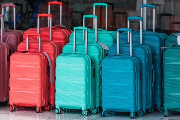 Bright Blue Red Green Row Suitcase Extended Handles Different Size — Stok Foto