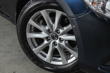 Novosibirsk, Russia  April 25 2021: Mazda 6, close-up of the bumper, alloy wheel, car detailing    clipart