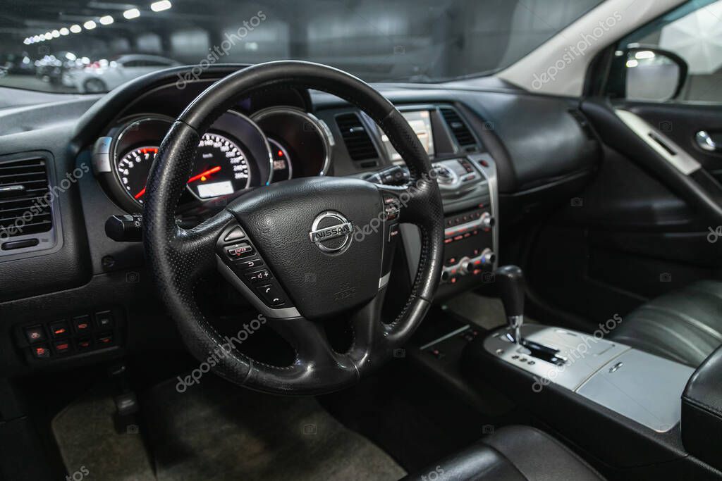 Novosibirsk, Russia - May 16, 2021: Nissan Murano, dashboard, player, steering wheel with logo and buttons, speedometer and tachometer