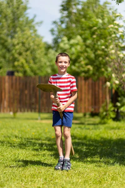 Little Cheerful Boy Stands Sits Shovel Horse Jumps Merrily Ready — Stock Photo, Image