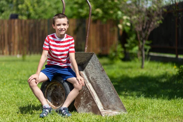 Little Boy Sitting Wheelbarrow Sunny Day Garden Boy Assistant Garden — Stock Photo, Image