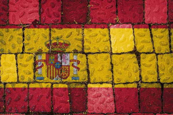 National flag of Spain on stone  wall background. Flag  banner on  stone texture background.