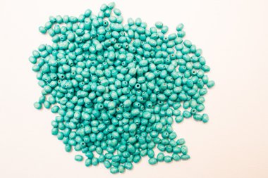 Green colorful beads isolated on white background