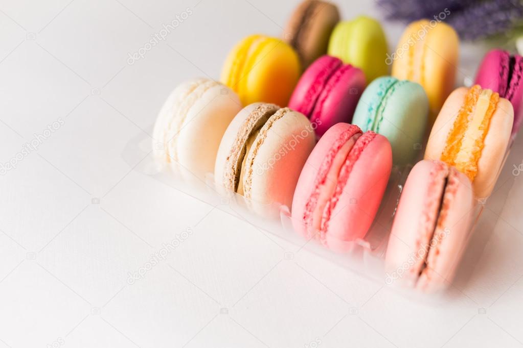 Box of french sweet delicacy macaroons isolated