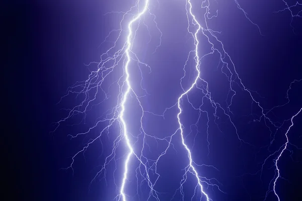 Lightnings in dark stormy sky — Stock Photo, Image