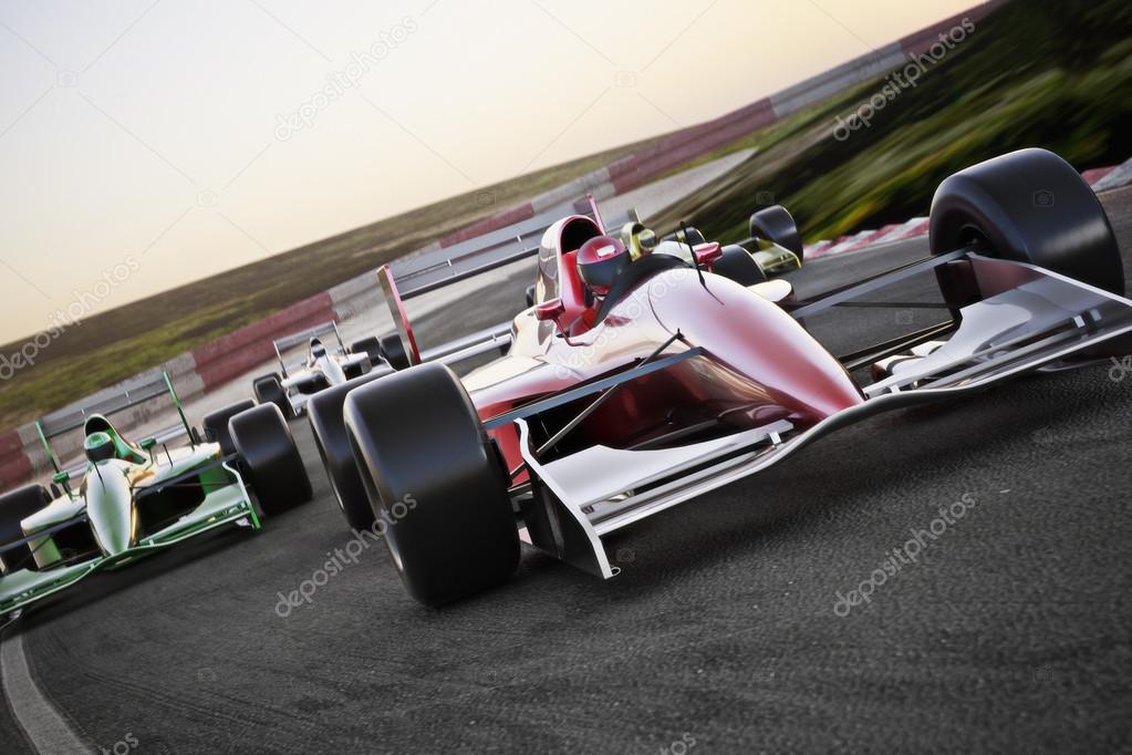 Red race car close up front view on a track leading the pack with motion Blur.