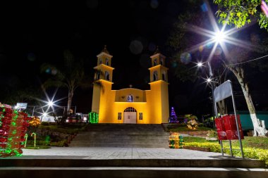 Historic church exterior in Xico, Veracruz, Mexico at night clipart