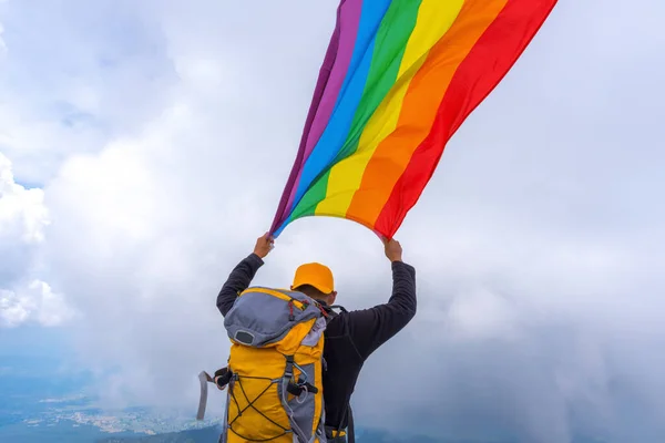 Hiker Backpack Standing Top Mountain Holding Pride Flag — Stock Photo, Image