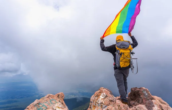 Hiker Backpack Standing Top Mountain Holding Pride Flag — Stock Photo, Image