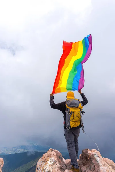 Hiker Backpack Standing Top Mountain Holding Pride Flag — Stock Photo, Image