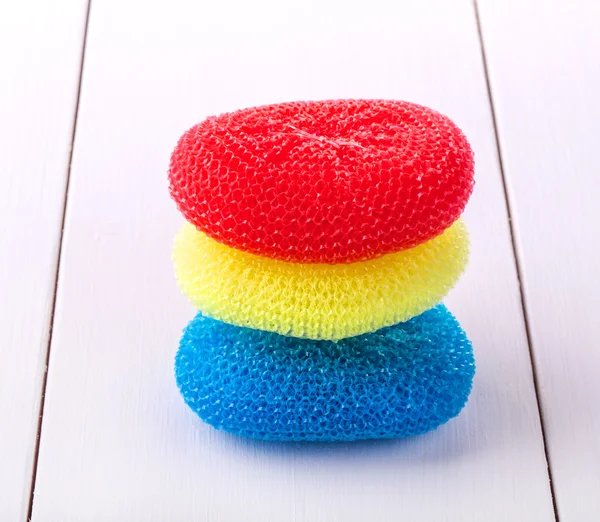 Round sponges for washing dishes in different colors — Stock Photo, Image