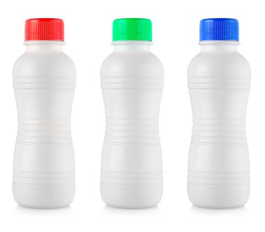 Renkli lidon beyaz arka planı olan mat beyaz plastik şişeler.