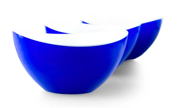 Three blue plates isolated on white background — Stockfoto