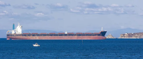 Empty container freighter ship waiting on Vladivostok, Russia