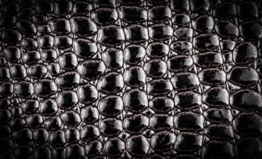 Siyah deri kaplama arka plan. Kapat.