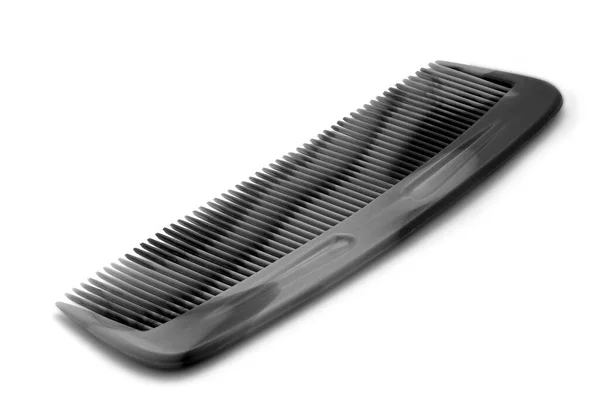 Black comb isolated on a white background. Close up — Stock Photo, Image