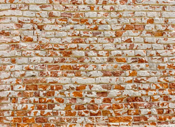 Antigua pared de ladrillo con textura de fondo de pintura blanca de cerca — Foto de Stock