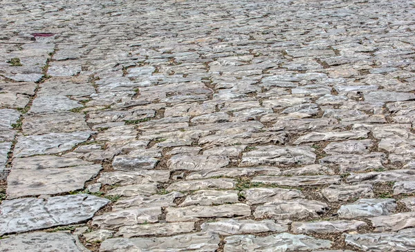 Oude stenen weg. Stenen wegstructuur. Selctieve focus — Stockfoto