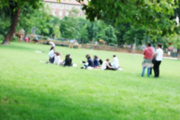 Fondo de las actividades de las personas en el parque con desenfoque intencional — Foto de Stock