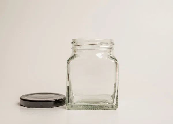 Glazen container op witte achtergrond — Stockfoto