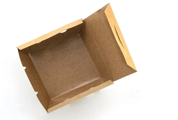 白い背景にエコ持ち帰り用の食品ボックスを開きました 中に防水コーティングを施した空の茶色の紙の食品箱 トップ表示画像 — ストック写真