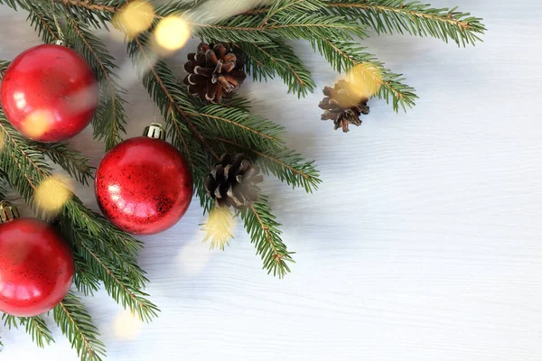 Red Balls Cones Glowing Garland Spruce Branch Holiday Decorations Christmas — Stock Photo, Image