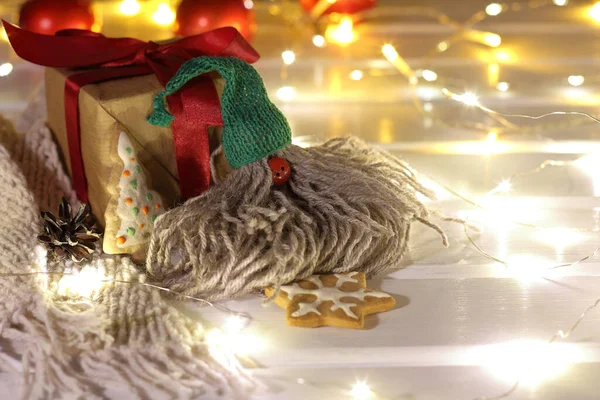 Gnome Green Hat Sits Next Gift Figured Cookies Backdrop Illuminated —  Fotos de Stock