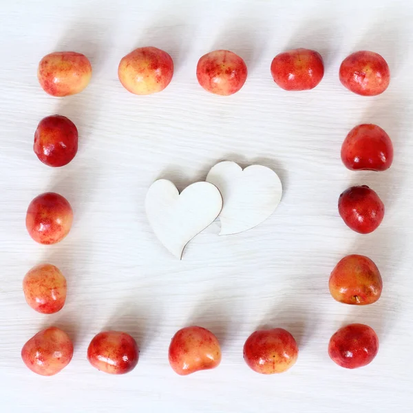 Flat Lay Two Heart Symbols Frame Sixteen Sweet Cherry Berries — Stock Photo, Image