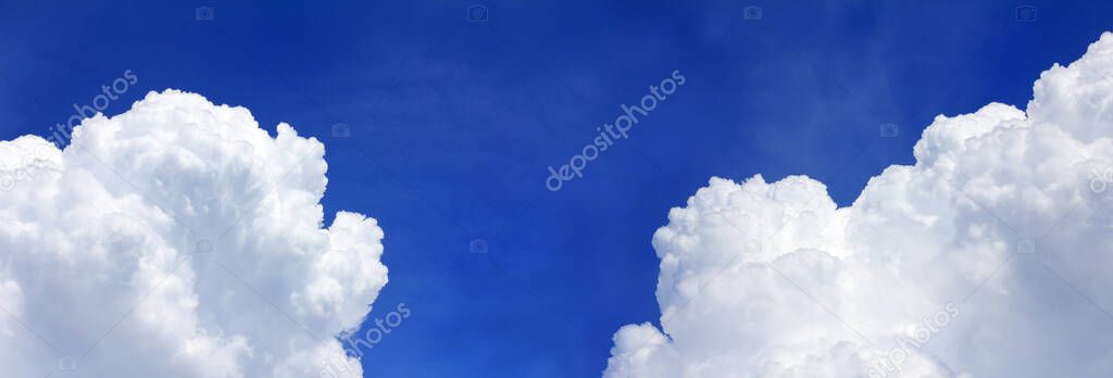 cumulus clouds against the blue sky. partly cloudy panorama