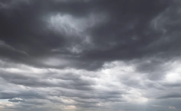 Dark storm clouds before rain used for climate background. Clouds become dark gray before raining. Abstract dramatic background.