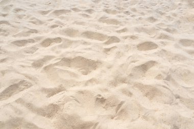 Yaz plajında kum dokusu arka plan olarak kullanılıyor. Yazın doğa plajı.