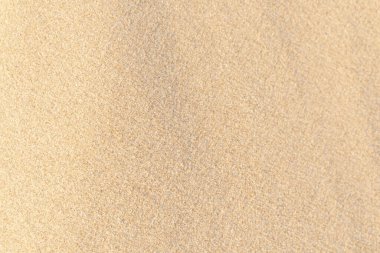 Kum dokusu geçmişi. Tropik plajda kahverengi çöl deseni. Yakın plan..