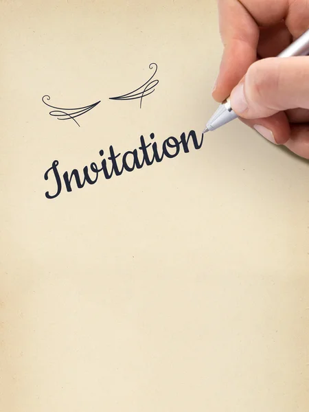 Hand writing "Invitation" on aged sheet of paper. — Stock Photo, Image