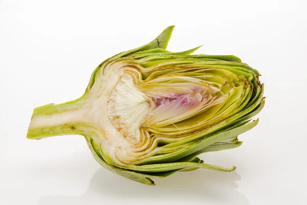 Fresh artichoke cut in half, isolated on white background. — Stock Photo, Image