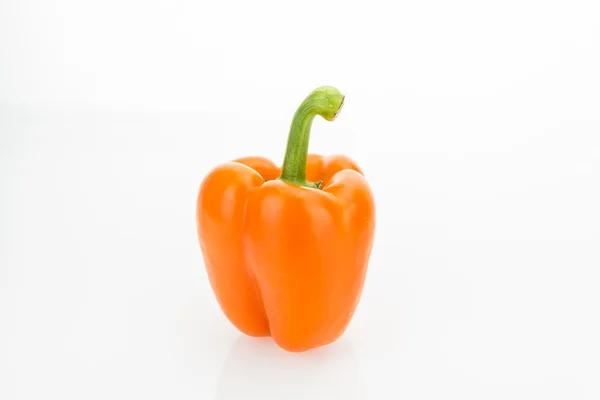 Fresh orange bell pepper, isolated on white background. Royalty Free Stock Images