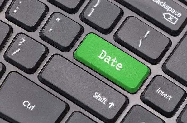 Dator tangentbord närbild med "Datum" text på grön gå in nyckel — Stockfoto